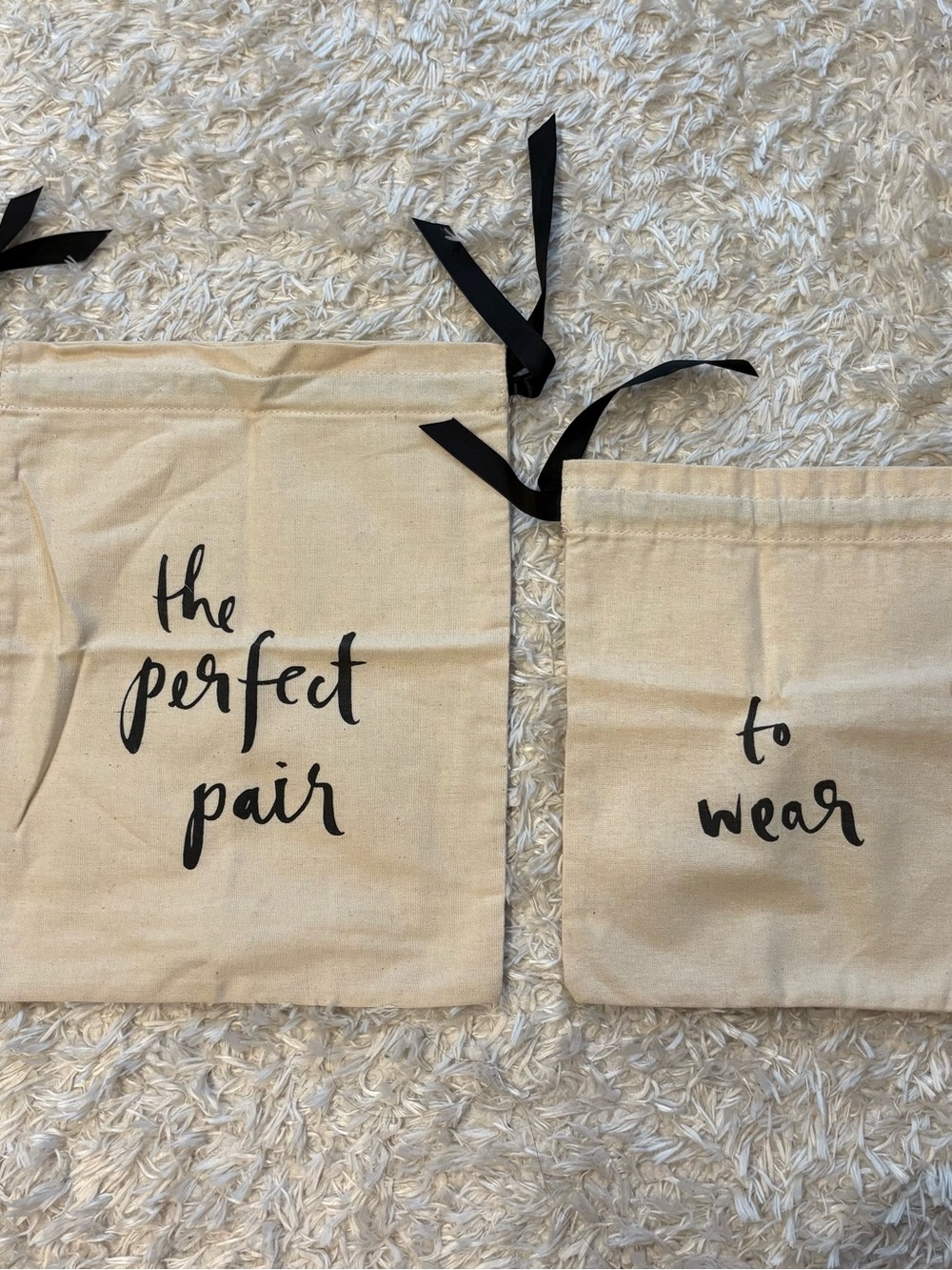 kate spade cream canvas drawstring dust bags with black script, drawstring